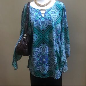 Very nice colorful blouse . Size XL